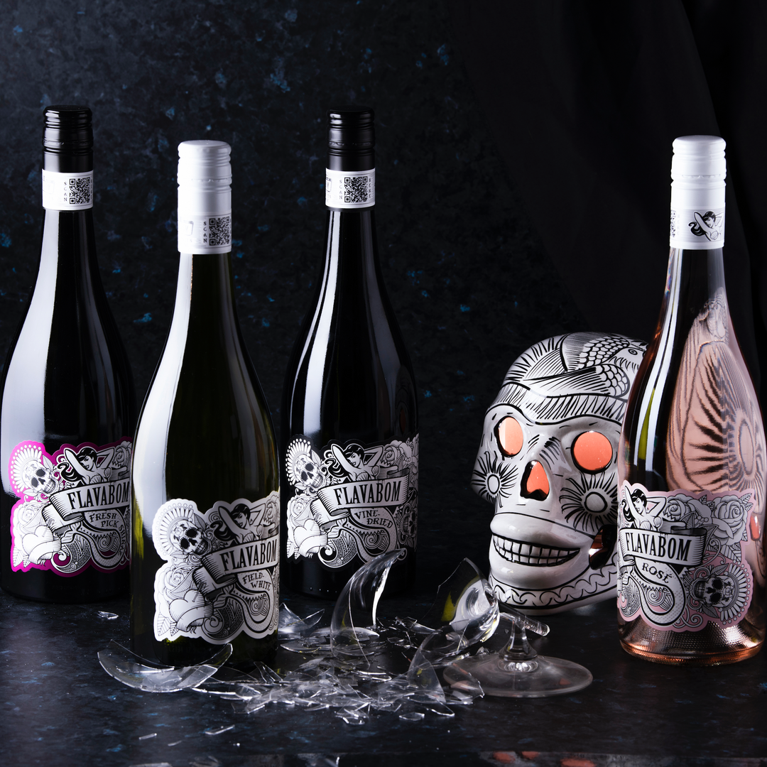 Flavabom Wine laying next to grapes and wheat