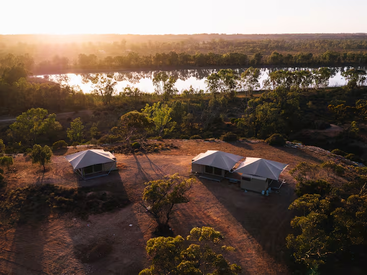 Aerial view of the eco-suite tents beside the river